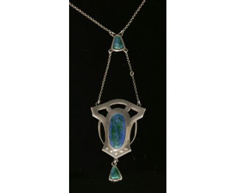 A sterling silver Arts and Crafts pendant,by Charles Horner, with a central pierced plaque with an oval bluish-green guilloch