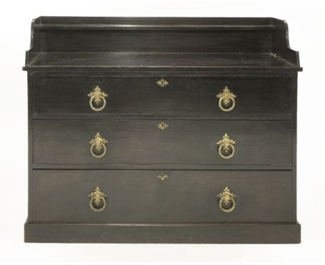 An ebonised pine chest of drawers, designed by Dr Christopher Dresser for Bushloe House, the raised back with a shelf over th