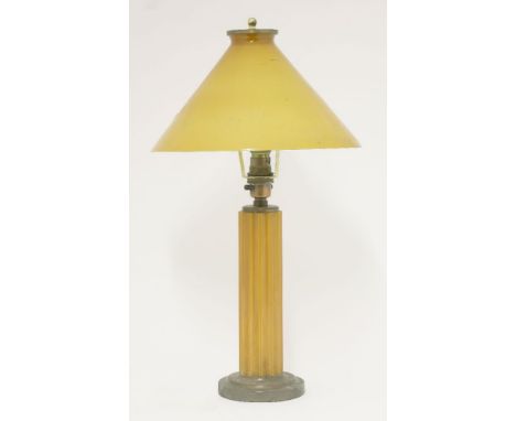 An Art Deco amber Bakelite table lamp,the conical shade cracked,45cm high