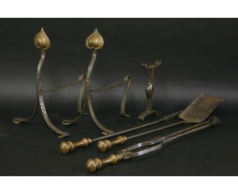 A set of Arts and Crafts wrought iron fire tools, anda pair of fire dogs, 65cm long (5)