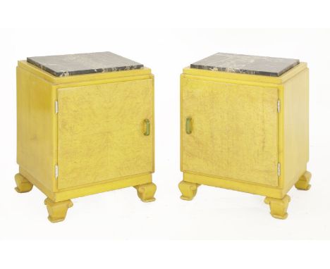 A pair of maple bedside cabinets, with inset marble tops, over a cupboard with a shelf, raised on shaped supports,40cm wide35