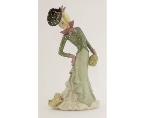 A Lenci figure of a lady looking at a dog on the hem of her dress,inscribed 'Lenci, Italia',35cm high