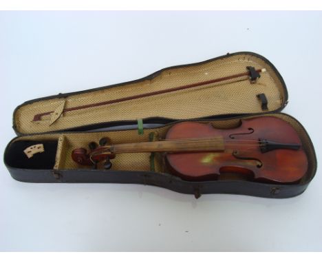 An early 20th Century 1/2 size violin, bears paper label 'Antonius Stradivarius Cremonensis Polishias Anno 1716'.  With bow, 