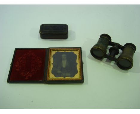 A Victorian ambrotype portrait of a seated gentleman in a case (hinge a/f), a 19th century papier mache snuff box and a pair 