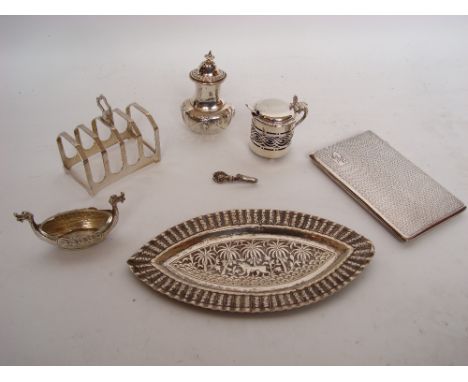 A small quantity of silver items to include a four division toast rack, Sheffield, 1932 by Emile Viner, a small pierced drum 