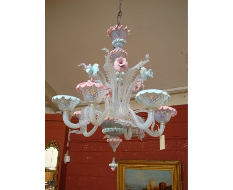 A 20th century Venetian pink opaline glass six light chandelier, the knopped baluster column stem above a bowl  issuing an in