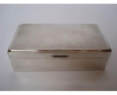 A George VI silver cigarette box, Birmingham, 1949 for Adie Brothers, of rectangular form with engine turned hinged lid, ceda