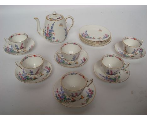 A 1920's Crown Staffordshire six setting tea service comprising teapot, six teacups, six saucers and five tea plates. 