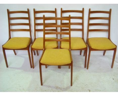 A set of five mid 20th Century Danish Stolefabrik teak ladder back dining chairs, with padded seats, covered in yellow fabric