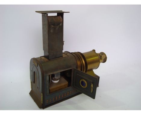 A late 19th Century magic lantern projector, with gilt brass lens and tin label, bears label Mawson Swan & Morgan Newcastle u