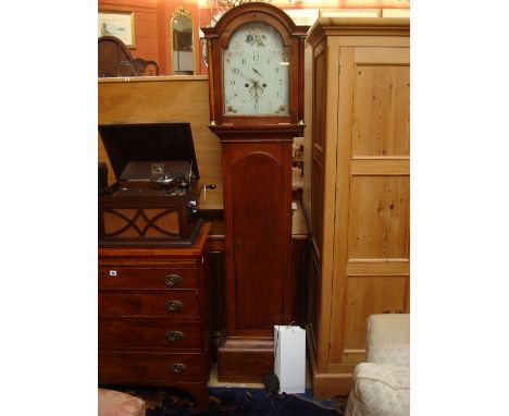 A George III oak longcase clock, the arched 12" white enamel dial with Roman and Arabic numerals, subsidiary seconds dial and