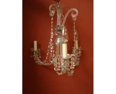 A Venetian cut glass three light chandelier, the central column issuing three downswept scroll candlearms and three upright s