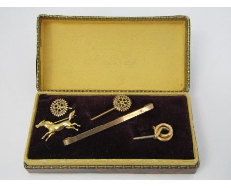 A 9ct brooch in the form of a galloping horse together with a further 9ct brooch - 4g total,  a knot stick pin with 15ct head