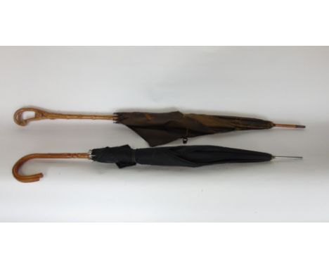 Interesting vintage parasol with stylised bamboo handle carved in the form of a fox stuck up a tree; together with a further 