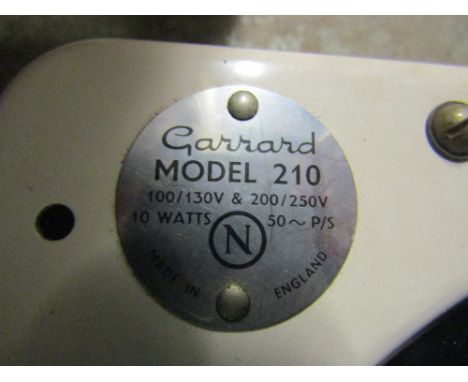 A vintage Garrard record player model 210, together with a Kurer Radionette