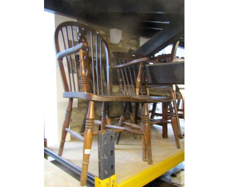 A Windsor hoop and stick back open elbow chair with pierced wheel splat in elm and beech, together with two Windsor kitchen c