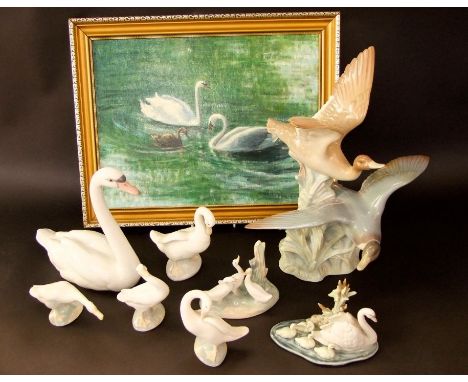 A Lladro group of a pair of ducks in flight above reeds, together with a Lladro Daisa figure - Graceful Swan 5230, (boxed), f