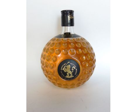 A bottle of Old St Andrews Scotch Whiskey with a novelty golf ball bottle, 18 cm high