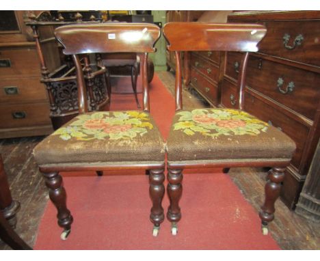 A set of eight mid 19th century mahogany dining chairs with shaped splat backs and raised on turned forelegs, all with hand w