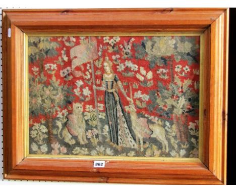 A petitpoint and grospoint tapestry picture showing medieval style scene with female character flanked by a lion and a unicor