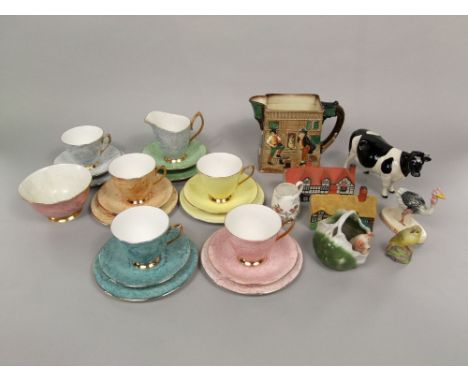 A collection of ceramics including a Royal Doulton relief moulded jug - The Pickwick Papers, a Beswick model of a Friesian co