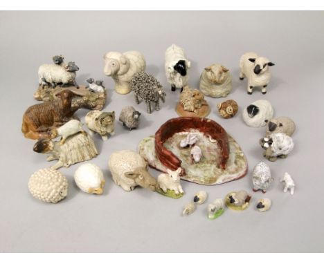 A collection of various ceramic and other models of sheep, together with a carved wooden example inscribed Bethlehem to base,