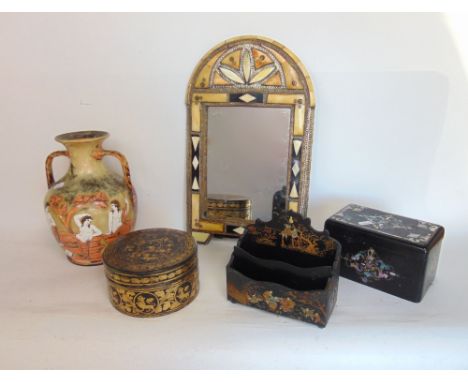 A Victorian papier mache and mother of pearl inlaid tea caddy the hinged lid enclosing a fitted interior together with a furt