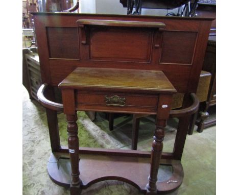 An Edwardian walnut hall stand of half height, with triple panel back over a central frieze drawer, flanked by umbrella/stick