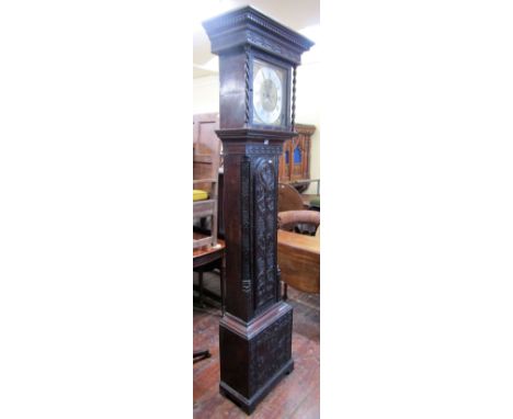 A Georgian oak longcase clock, the casework with later carved geometric detail, the hood enclosing a square brass dial and ap