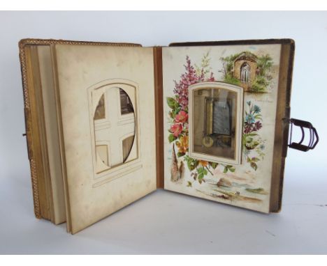 19th century leather bound musical photo album, fitted with French musical column with small cylinder and comb and various bl