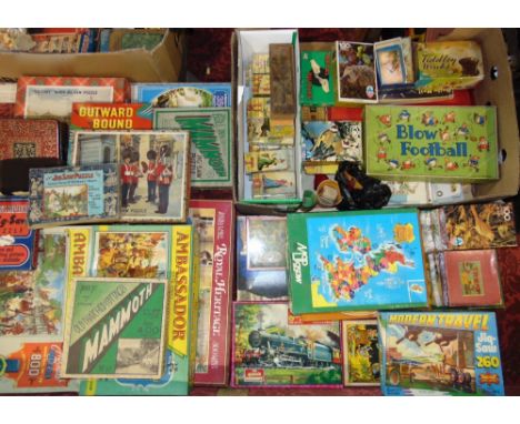 Two boxes containing a large collection of vintage puzzles