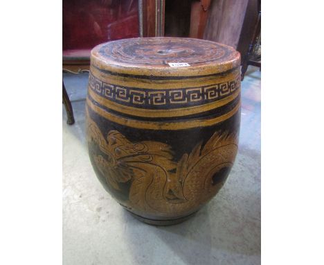 A Chinese ceramic barrel shaped garden seat with incised wrythen dragon detail