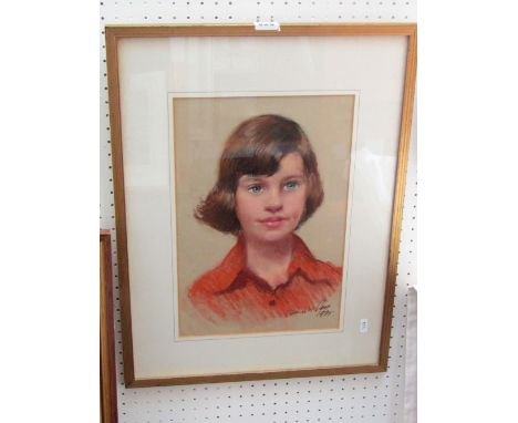 A 20th century pastel shoulder length study of a young girl in a red blouse, indistinctly signed bottom left Ray? and dated 1