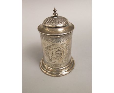 Late Victorian silver caddy, of cylindrical form with stepped circular lid and Islamic finial, engraved with the crest of a d