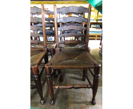 A set of six ash wood ladder back dining chairs in the 18th century rural manner with rush work seats