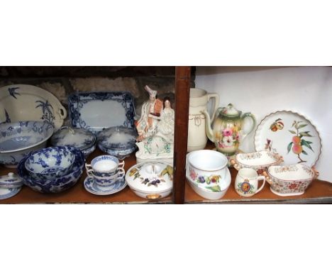 A 19th century Staffordshire clock group with applied highland figure decoration, various blue and white printed wares includ