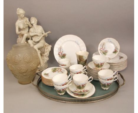 A continental porcelain figural character group of a romantic scene with a seated gentleman and a mandolin and his lover, sig