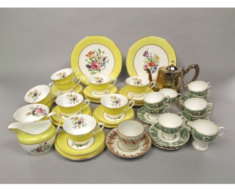 A collection of Royal Worcester Miranda pattern yellow ground tea wares including milk jug, sugar bowl, pair of cake plates, 