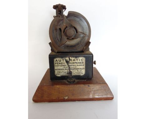 A vintage automatic pencil sharpener by the Automatic Pencil Sharpening Co