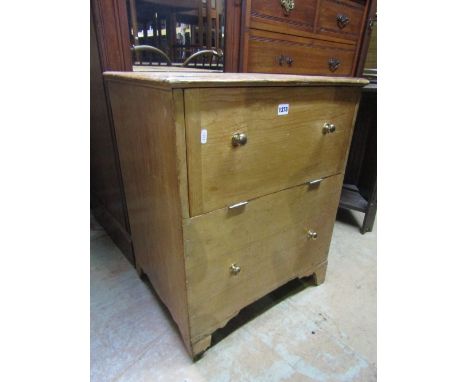A low stripped pine side cupboard, the front elevation with partial fall front over a dummy drawer raised on bracket supports
