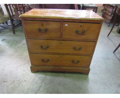 A small late Victorian satin birch bedroom chest of two long and two short drawers raised on bracket shaped supports, 84 cm w