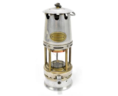 CREMER/WOLF OF LEEDS; An aluminium and brass circa 1910 miners safety lamp, height 23cm.&nbsp;