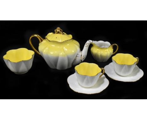 WILEMAN FOLEY; a seven piece tea service in the Dainty shape, with gilt highlights.Additional InformationTeapot has large cra