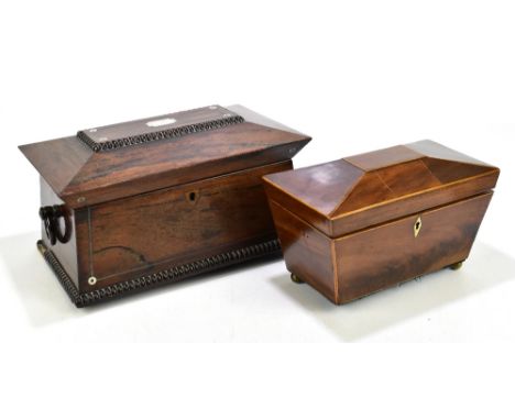 A William IV inlaid mahogany tea caddy of shaped rectangular form, inlaid with pewter and mother of pearl detail, with two lo