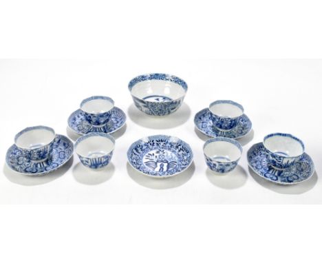 A late 19th century Chinese blue and white porcelain bowl with moulded body decorated with figures in landscape, between flor