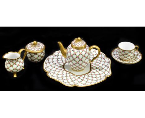 SEVRES; a late 19th century porcelain tea for one set comprising shaped tray, teapot, sucrier and cover, jug and cup and sauc