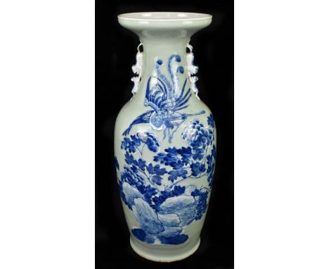 A large Chinese blue and white twin handled vase decorated with a phoenix over landscape over a celadon ground, height 61cm.A