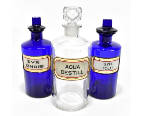 Three 19th century apothecary chemist bottles, including two blue glass examples with dummy stoppers and glass labels, 'Syr; 