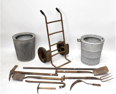 A small group of vintage tools and two galvanised dolly tubs.