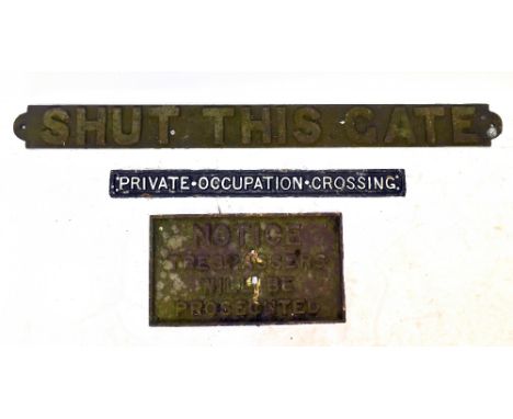 A vintage cast iron 'Shut this Gate' sign, length 99cm, with a 'Private Occupation Crossing' cast iron sign and a cast iron '